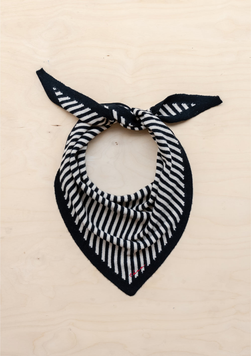 TBCo Merino Triangle Scarf in Black Stripe with classic black and cream stripes and red embroidered logo on soft merino wool.