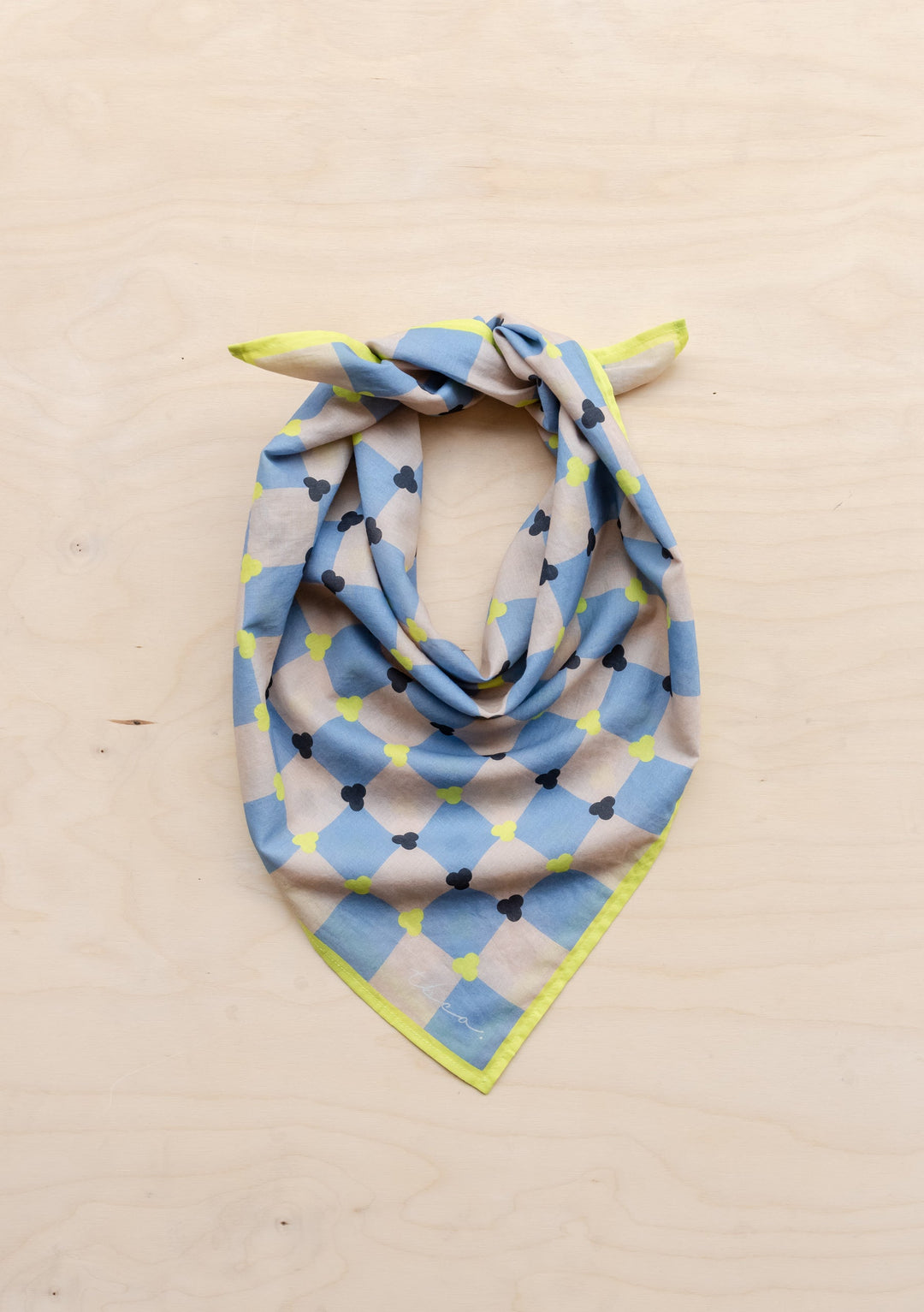 TBCo Cotton Square Scarf in Blue Checkerboard pattern, elegantly draped to show geometric print with blue and yellow accents