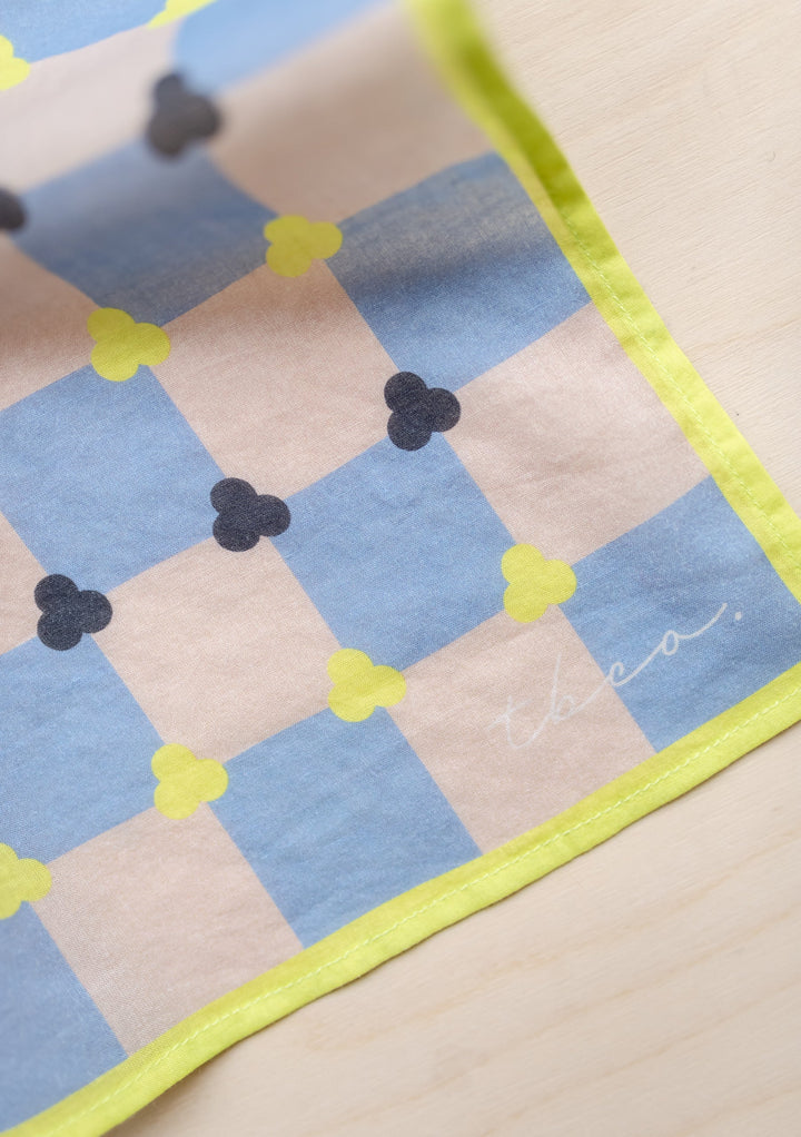 TBCo Cotton Square Scarf featuring blue and cream checkerboard pattern with yellow trim and charcoal floral accents