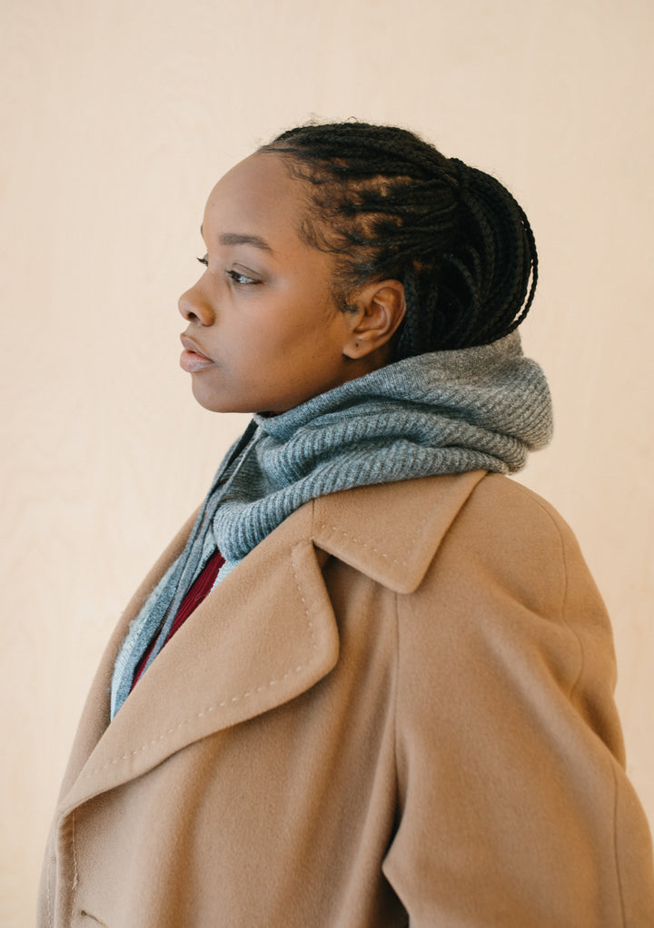 TBCo Merino Hood in Charcoal shown with camel coat, displaying cosy knit texture and versatile styling of premium wool hood scarf