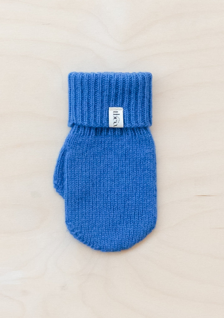 TBCo Merino Wool Kids Mittens in bright blue with ribbed cuff, showcasing classic knit pattern and brand label