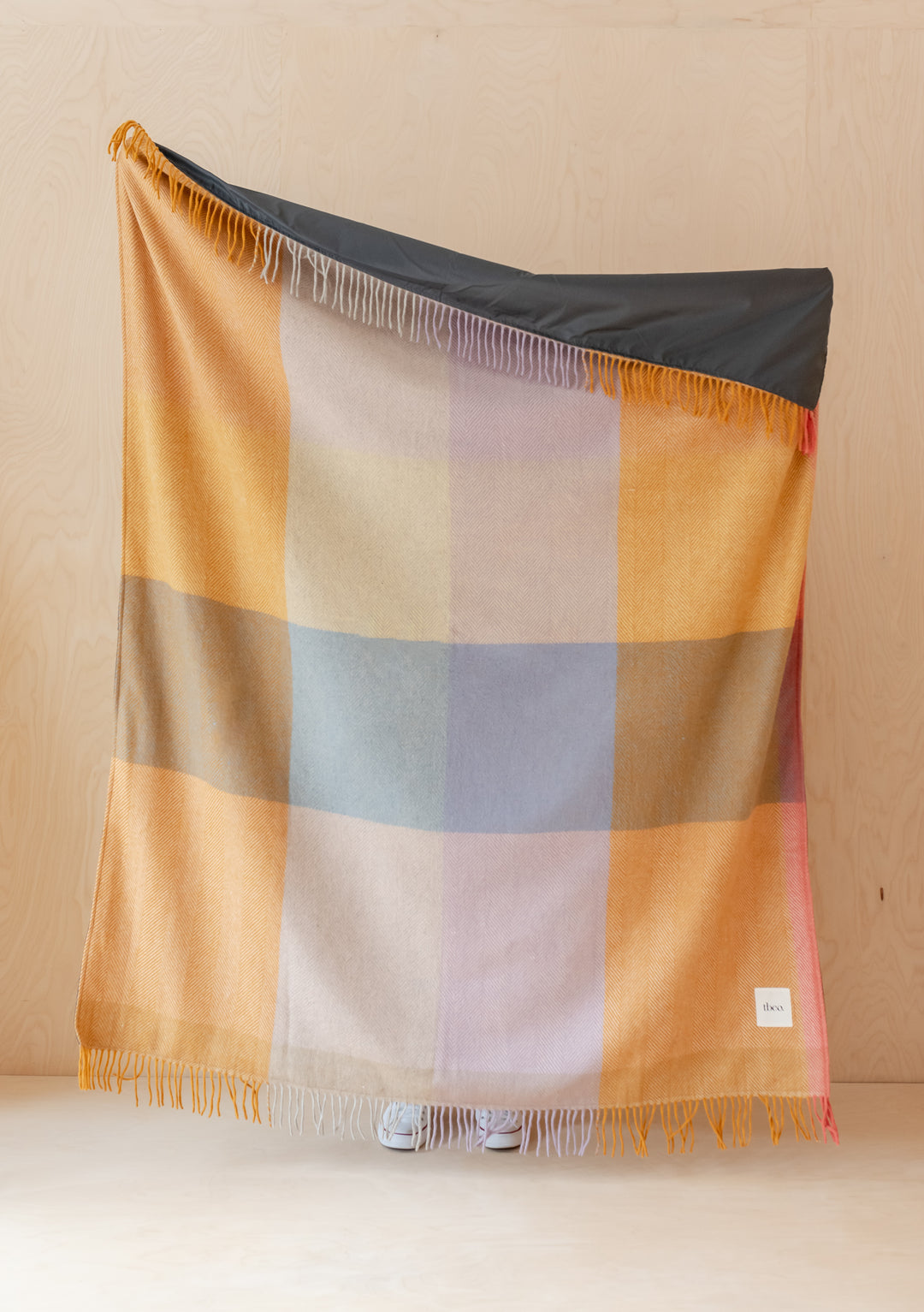 TBCo Recycled Wool Picnic Blanket in Mustard Frame Check displayed with fringed edges showing colourful checkered pattern