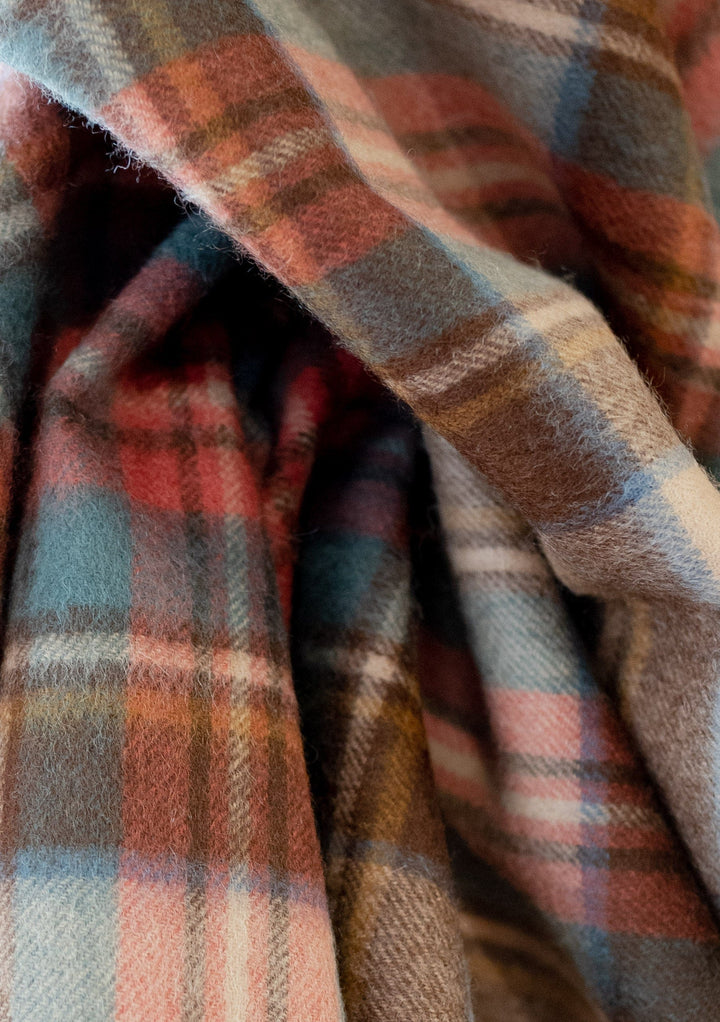 TBCo Men's Cashmere Scarf in Stewart Dress Antique Tartan, featuring soft folds showing plaid pattern in camel, brown, red and green