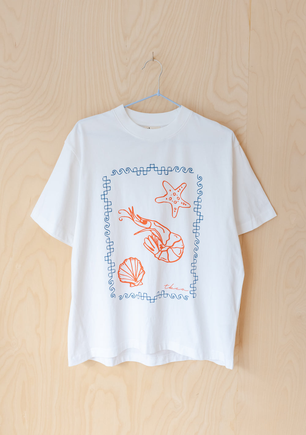 TBCo Cotton T-Shirt in White Shrimp featuring red sea creatures illustration with blue geometric border on white cotton tee