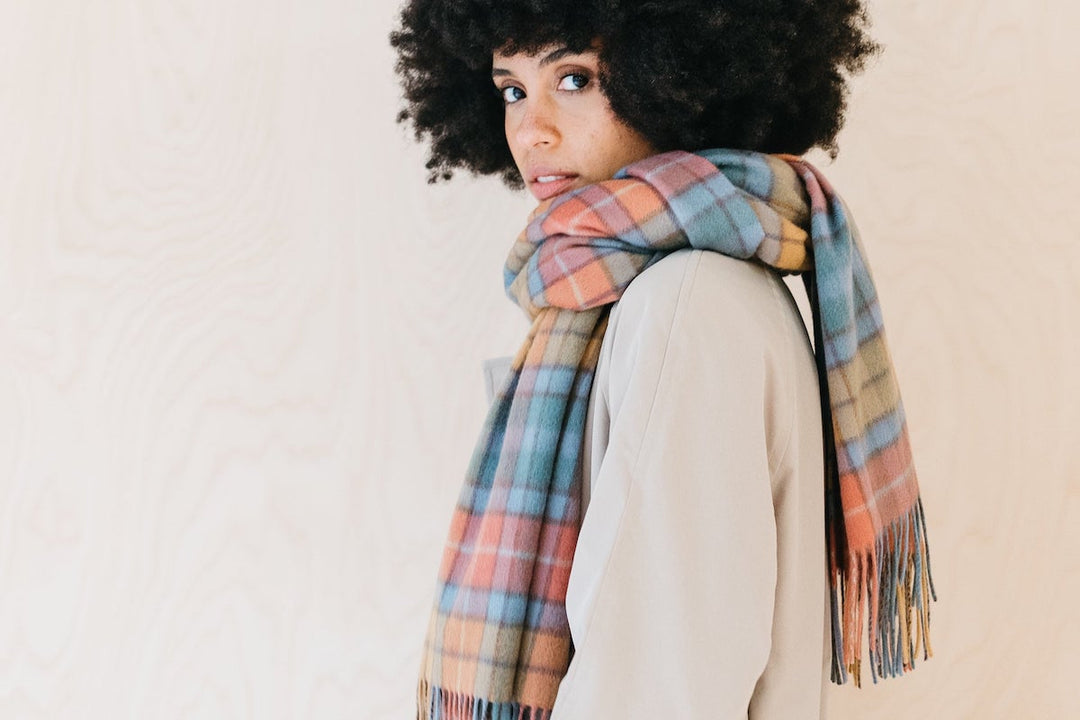 Model wearing a TBCo lambswool scarf in buchanan antique tartan