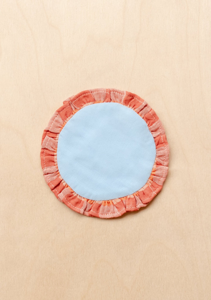 TBCo cotton coasters in blue apricot featuring a soft woven texture design . Designed for stylish and practical table protection, these eco-friendly coasters add warmth and sophistication to any home decor.