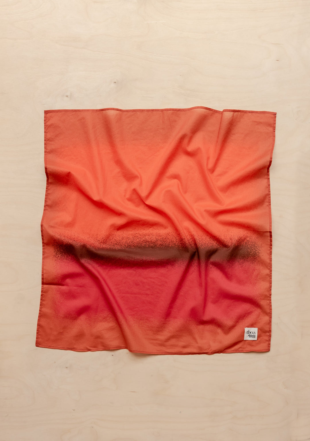 Sample Sale TBCo x Abisola Omole Hues Cotton Scarf in warm red and orange tones with subtle texture detail by TBCo