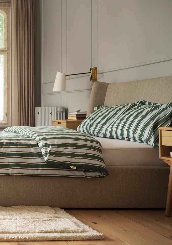 TBCo Cotton Duvet Cover & Pillowcases Set in Blue Stripe with green and white stripes on a cozy upholstered bed frame