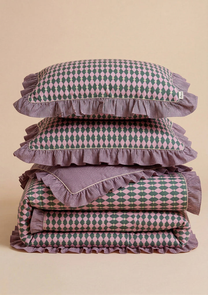 Stacked Cotton Duvet Cover & Pillowcases Set in Pink Harlequin by TBCo with green diamond pattern and striped ruffle trim