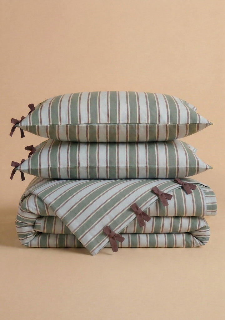 Stacked Cotton Duvet Cover & Pillowcases Set in Blue Stripe by TBCo with brown tie details on soft fabric