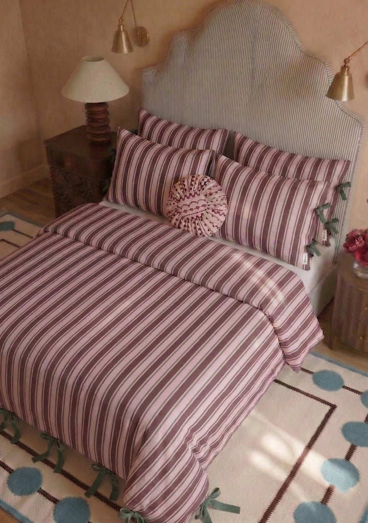 Pair of Cotton Pillowcases in Pink Stripe by TBCo with vertical pink and white stripes on styled bed setting