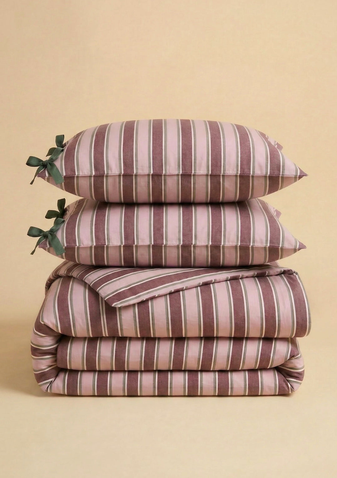 Stacked Cotton Duvet Cover & Pillowcases Set in Pink Stripe by TBCo with green bow details on soft fabric