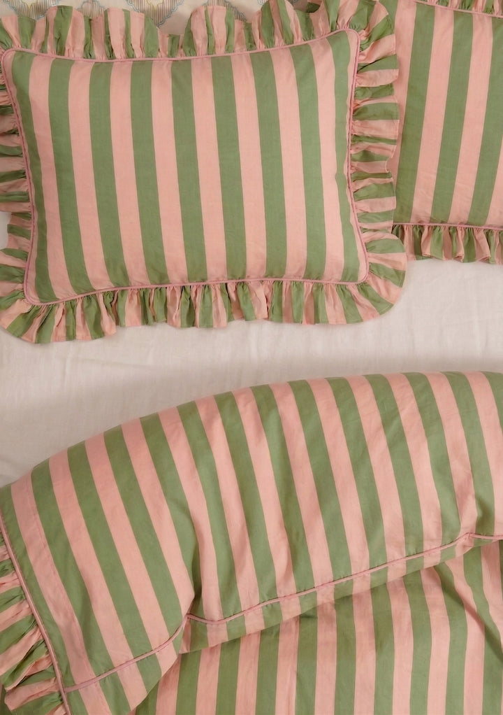 Cotton Duvet Cover & Pillowcases Set in Green Stripe by TBCo with ruffled edges on soft bed linen background