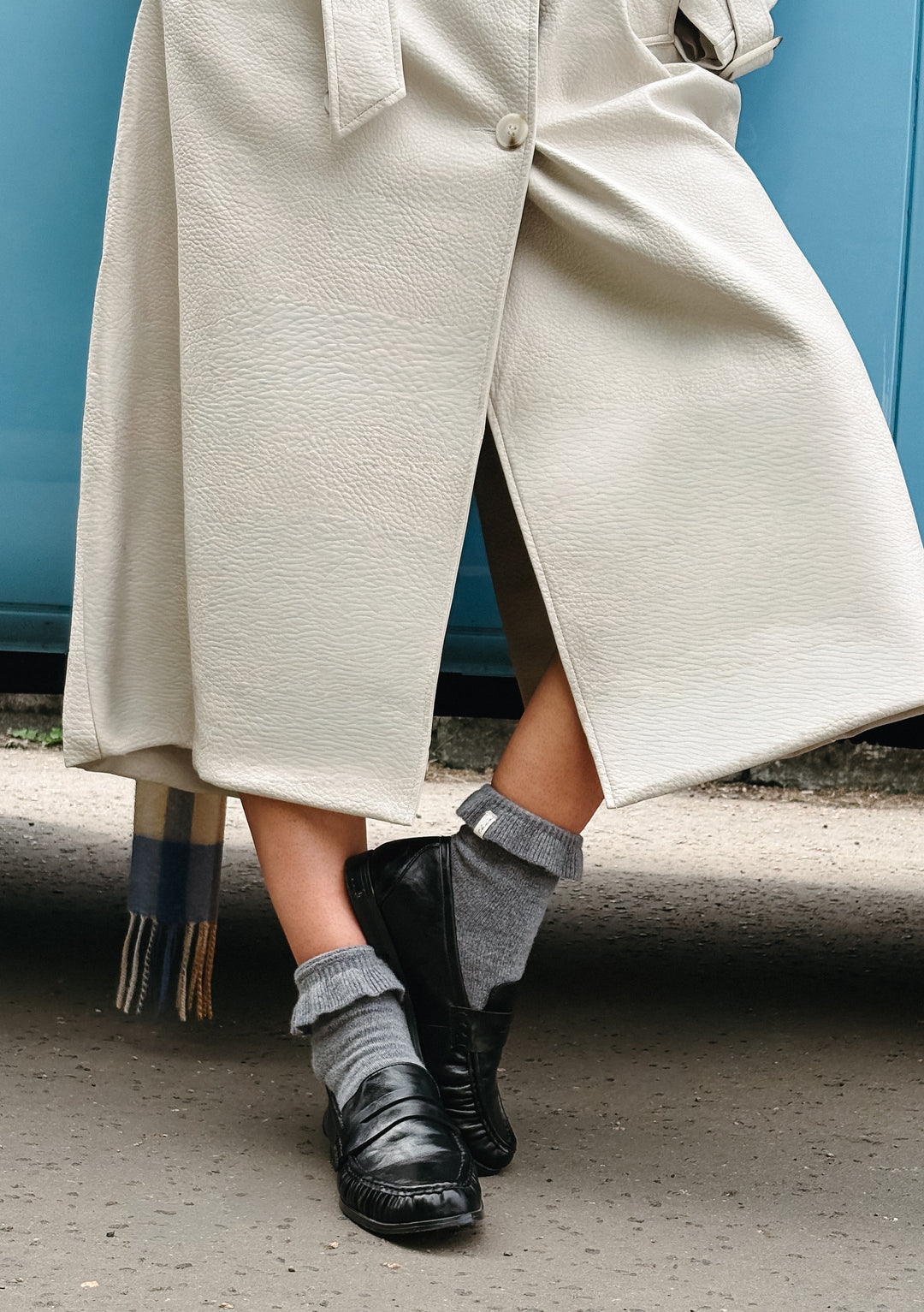 TBCo Merino Wool Socks in Charcoal Frilly worn with black shoes and cream textured coat, showcasing soft wool fabric detail