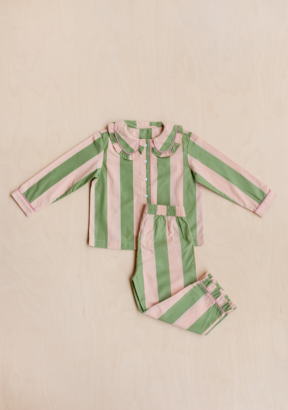 TBCo Cotton Kids Pyjamas in Green Stripe set with Peter Pan collar and elasticated trousers on cream background