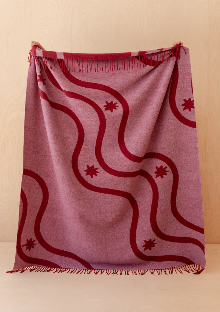 Couverture en laine d'agneau en jacquard à vagues rouges