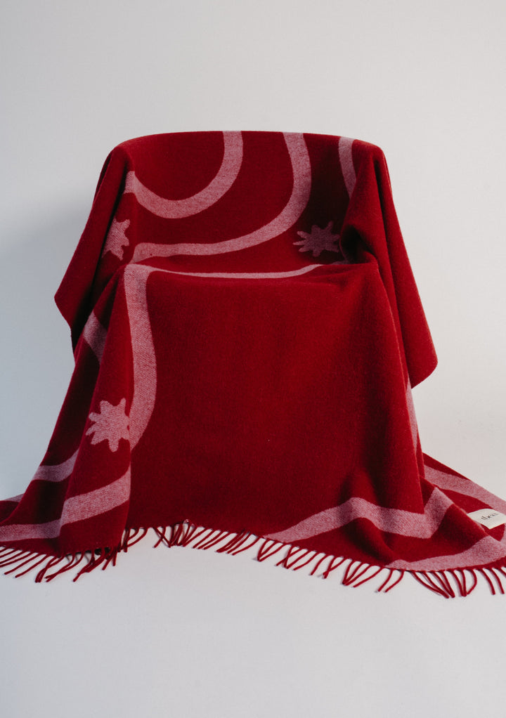 Couverture en laine d'agneau en jacquard à vagues rouges