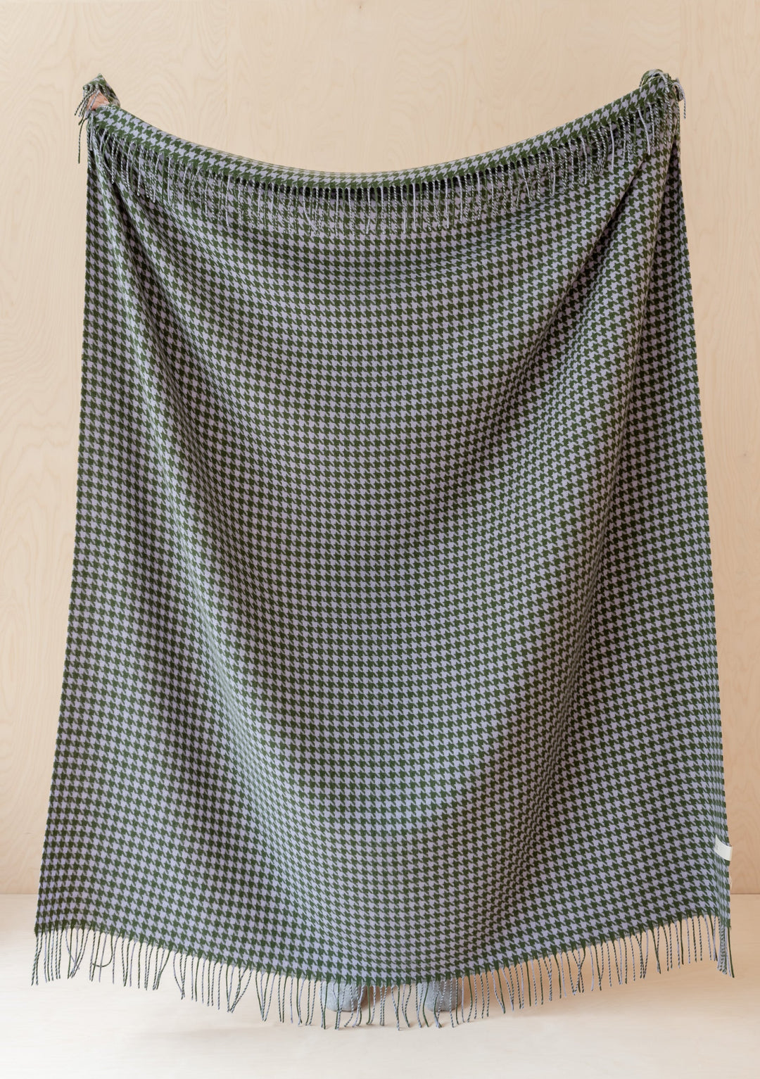 TBCo Lambswool Blanket in Olive Houndstooth pattern displayed with fringe detail against neutral background