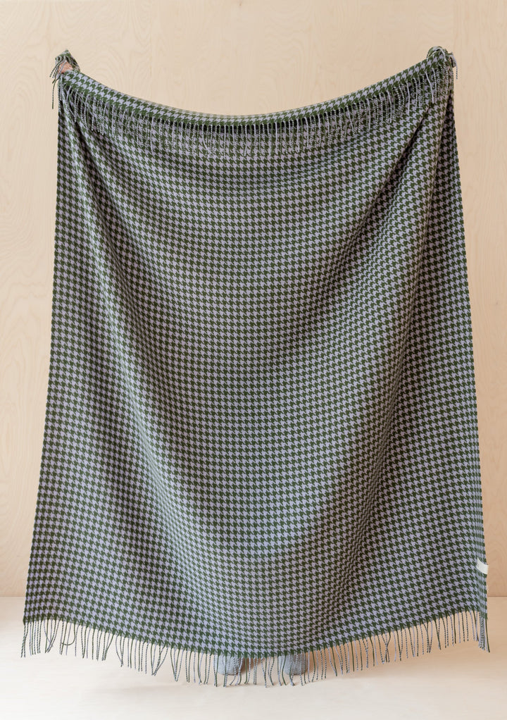 TBCo Lambswool Blanket in Olive Houndstooth pattern displayed with fringe detail against neutral background