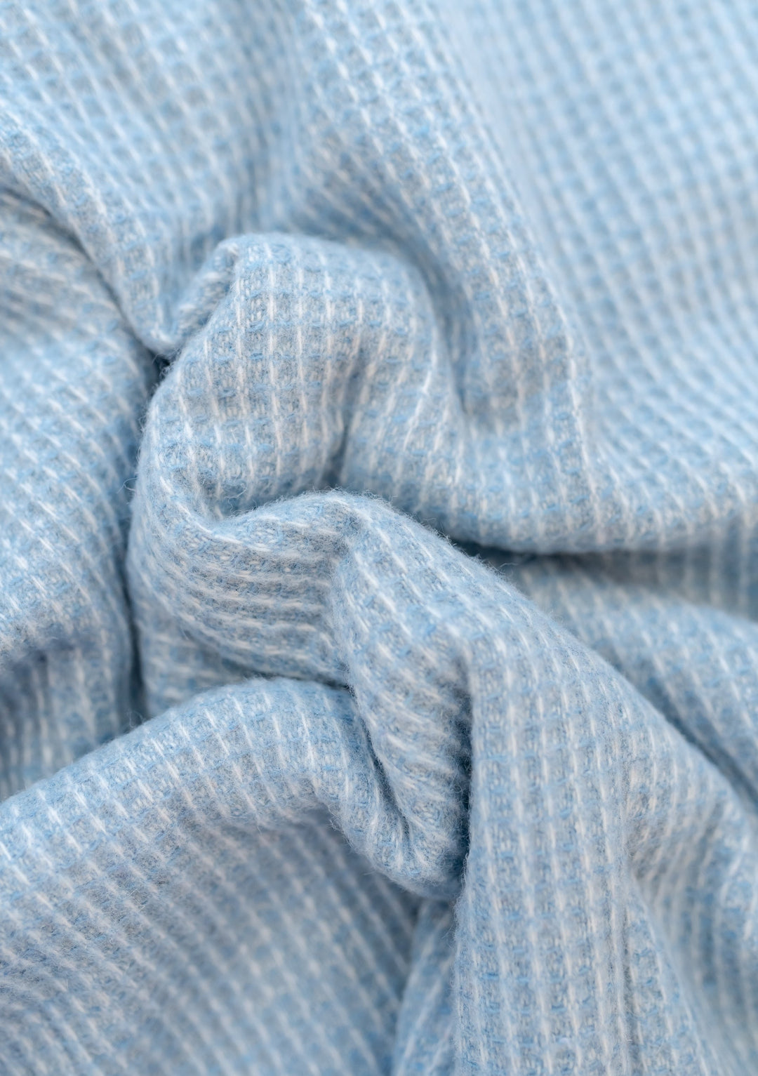 Close-up texture detail of TBCo Recycled Wool Blanket in Azure Waffle showing soft woven waffle weave pattern