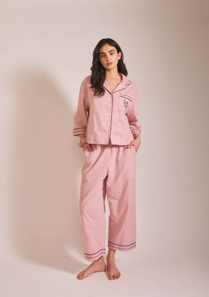 Woman standing wearing TBCo Cropped Cotton & Linen Pyjamas in Pink with blackberry embroidery gallery 2 portrait