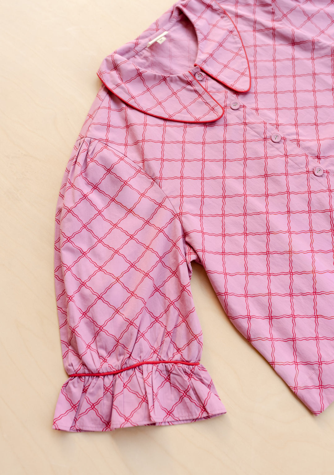 Close-up of sleeve and collar of TBCo Cropped Cotton Pyjamas in Pink Lattice, gallery position 8, portrait 1442x2048
