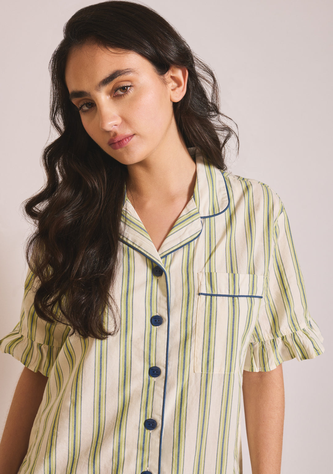 Portrait shot gallery 4 of TBCo Cotton Pyjamas in Olive Stripe Ruffle showing striped cotton poplin fabric with ruffled sleeves