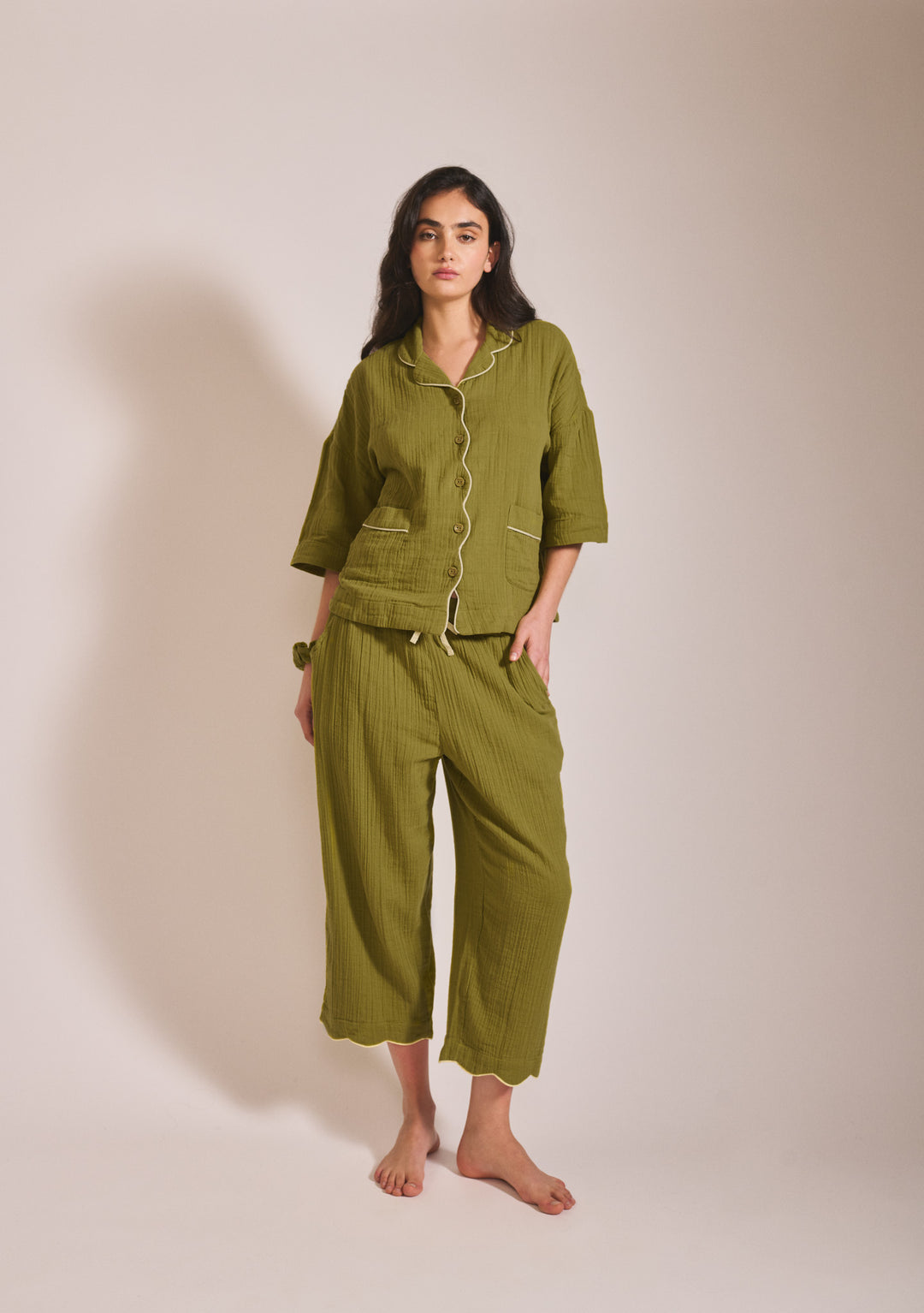 Model wearing TBCo Cropped Cotton Pyjamas in Green with yellow piping, front view, gallery position 1 portrait image