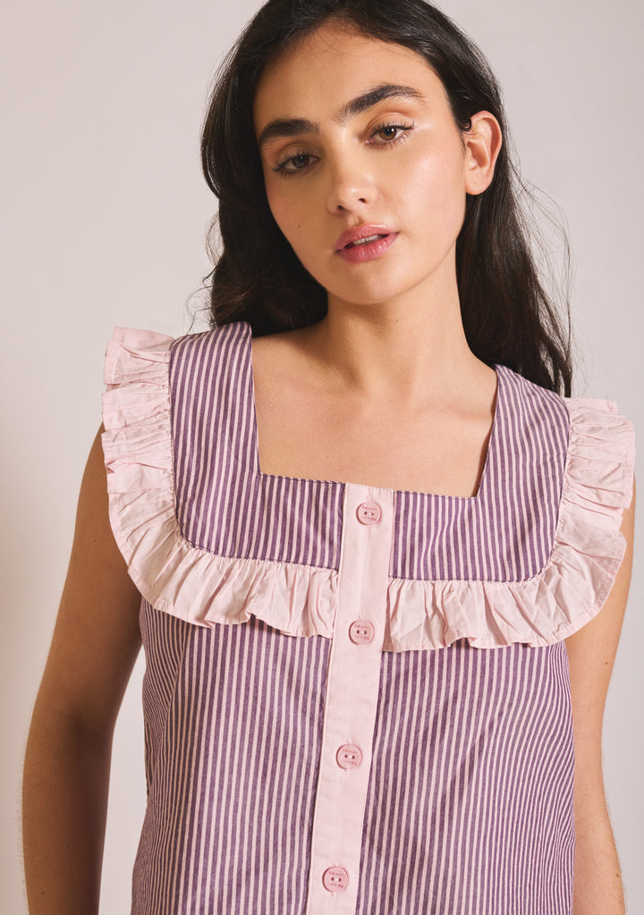Model wearing TBCo Cropped Cotton Pyjamas in Burgundy Stripe Ruffle, gallery 4 with ruffle detail and button front.
