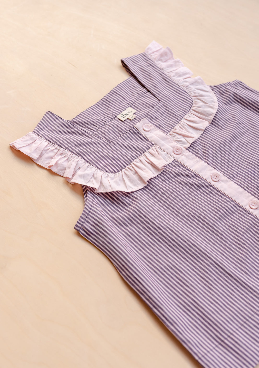 TBCo Cropped Cotton Pyjamas in Burgundy Stripe Ruffle laid flat, gallery position 6, showing ruffle detail and buttons.