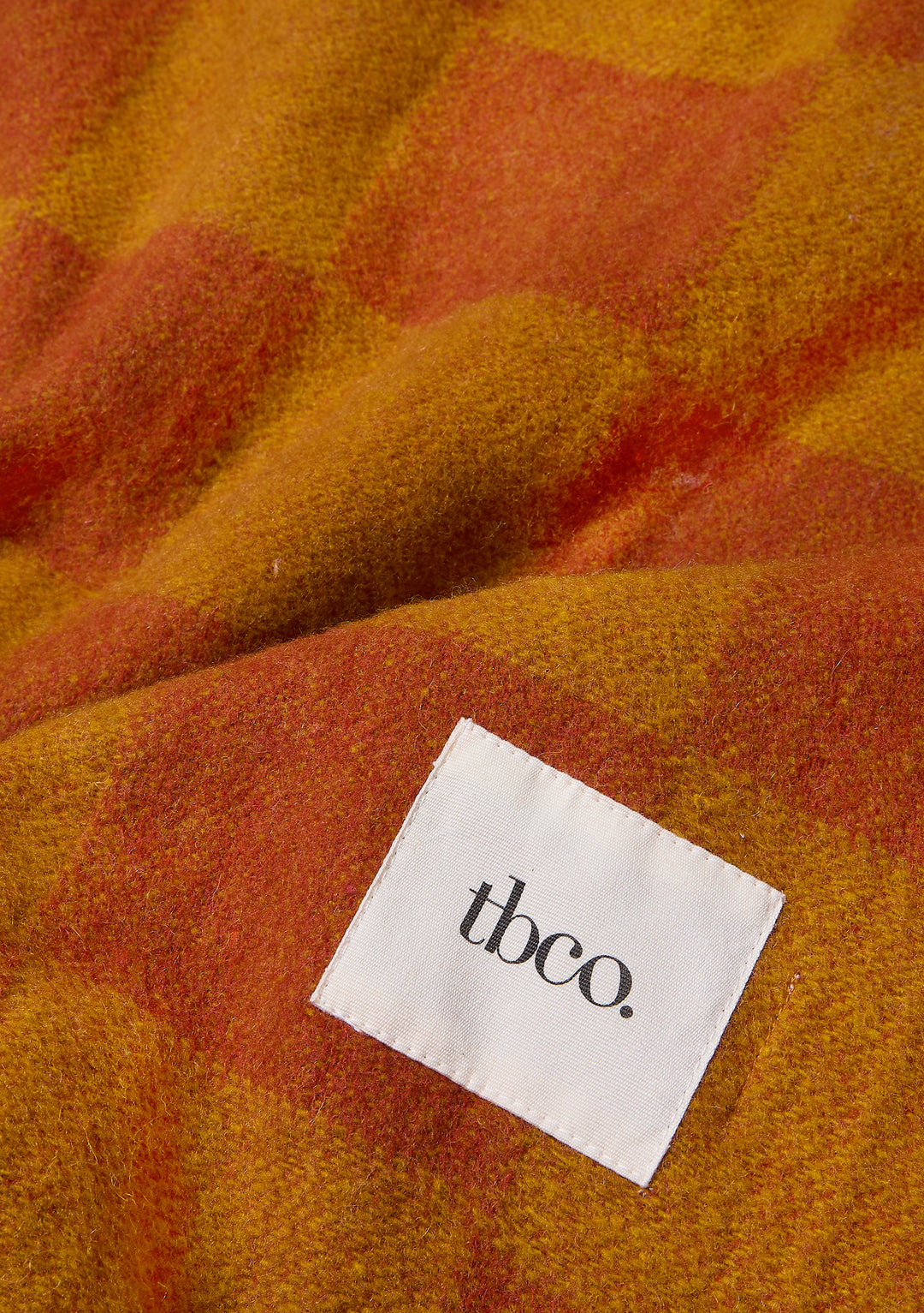 Couverture en laine recyclée à motif damier moutarde et orange