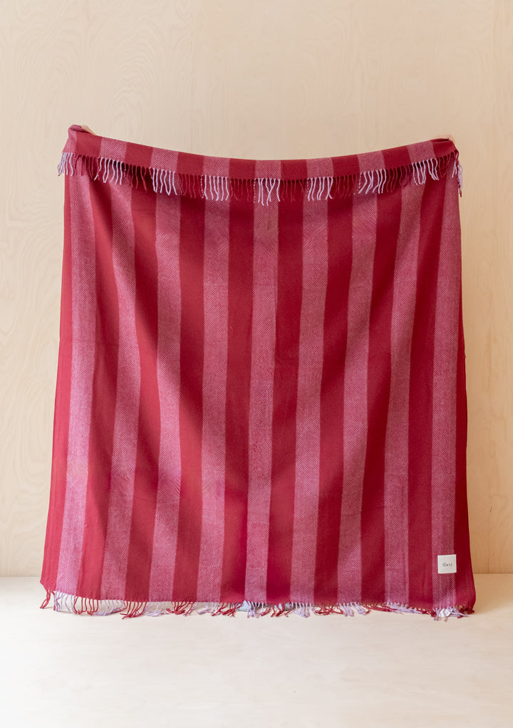 TBCo Sample Sale Recycled Wool Blanket in Lilac Diamond Stripe draped showing soft woven texture and fringed edges