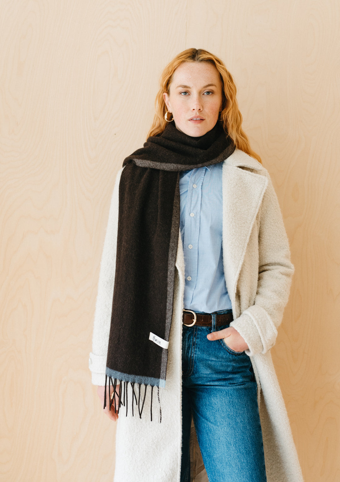 TBCo Cashmere & Merino Scarf in Brown Contrast Edge styled with white winter coat and light blue button-down shirt