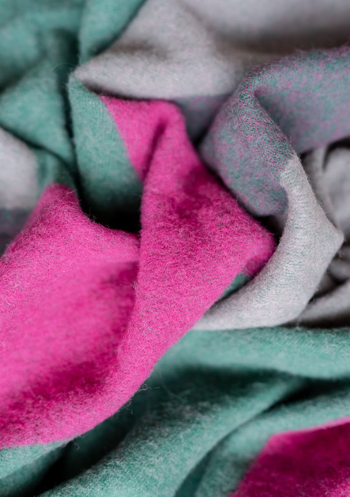 TBCo Lambswool Oversized Scarf in Block Jacquard featuring green and fuchsia geometric pattern with soft textured wool detail