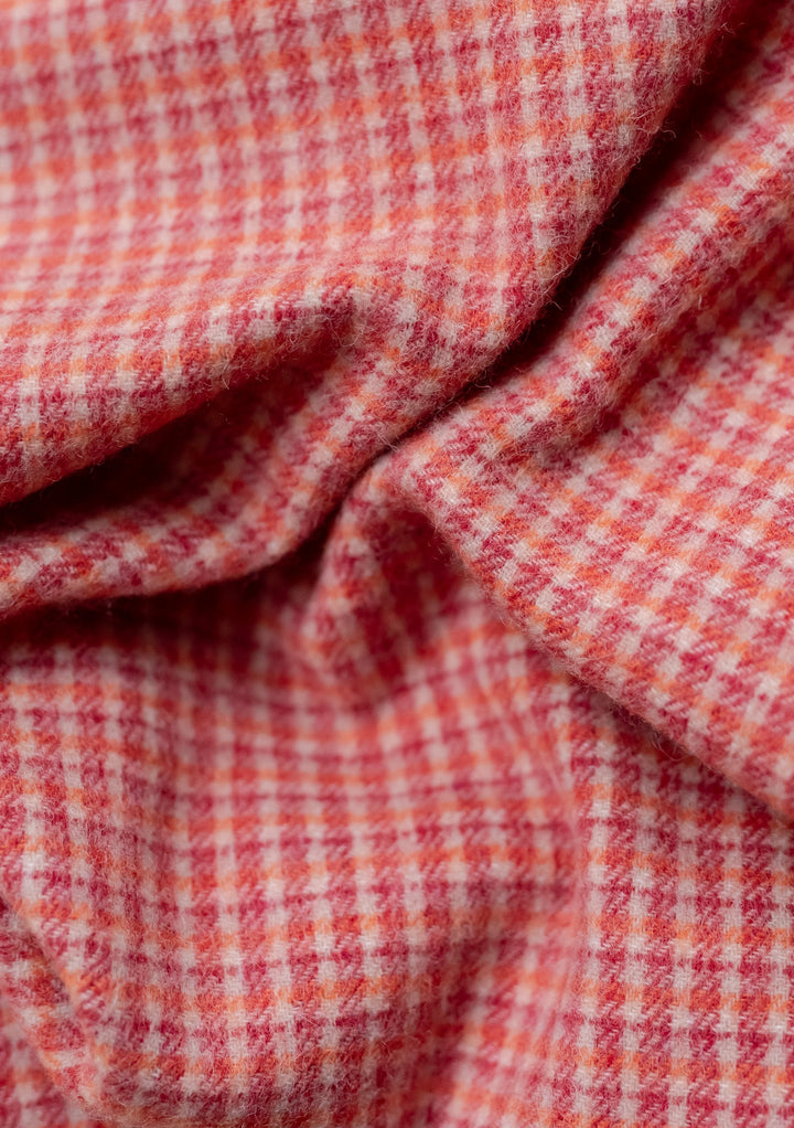 Close-up of soft woven texture on TBCo Sample Sale Lambswool Blanket Scarf in Berry Textured Check pattern