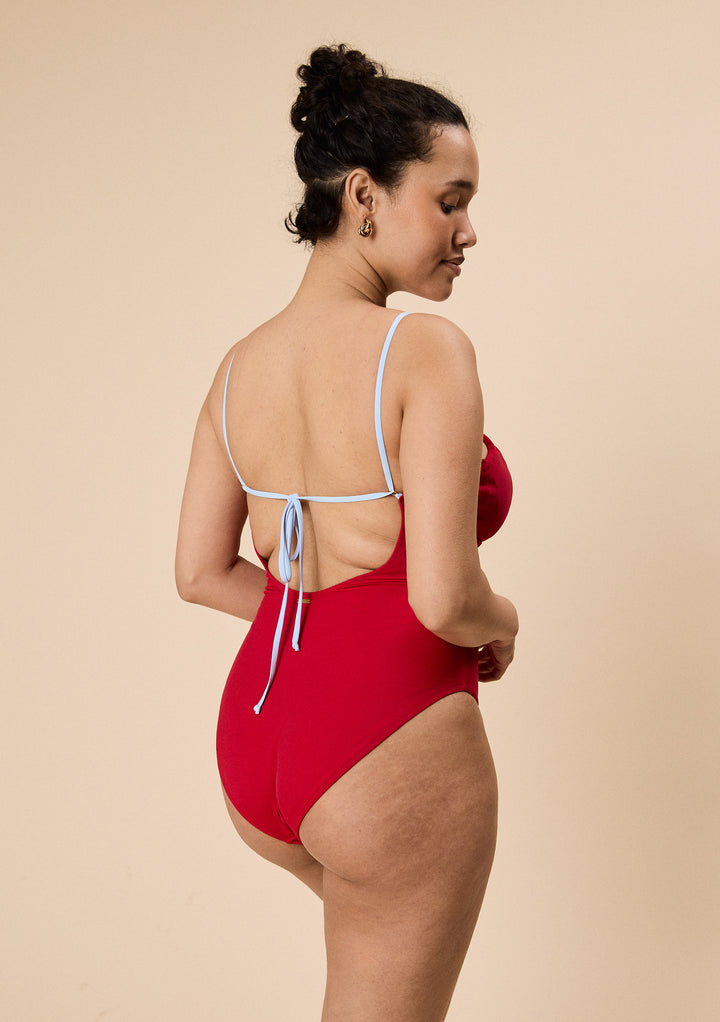 Woman wearing TBCo Gathered Swimsuit in Red & Blue crafted with natural & recycled fibres, Certified B-Corp, Women-Founded, designed to make an impact
