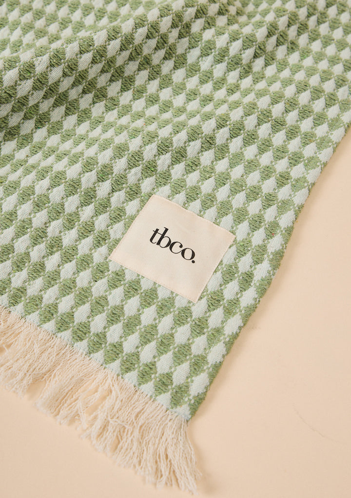 Cotton Throw in Green Argyle by TBCo with jacquard weave, natural and recycled fibres, Certified B-Corp, Women-Founded, designed to make an impact