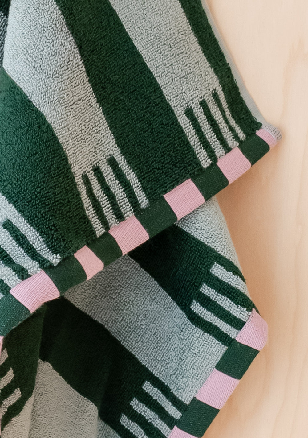 TBCo Terry Cotton Towels in Green Stripe with contrasting pink checkerboard edges, soft and absorbent 100% cotton fabric.